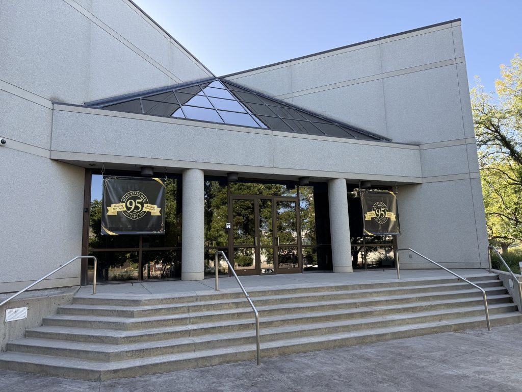 Utah Law & Justice Center exterior photo with banners of the 95th Anniversary