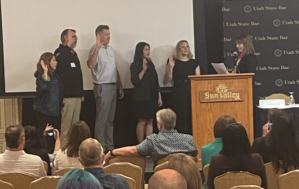 Commissioners' Photo (L to R): Yvette Donosso, Walter Romney, Jr., Jeremy Reutzel, Ezzy Khaosanga, Ashley Biehl, and Utah Supreme Court Justice Paige Petersen