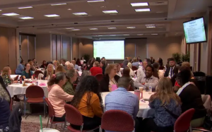 135 Access to Justice Summit participants seated at round tables