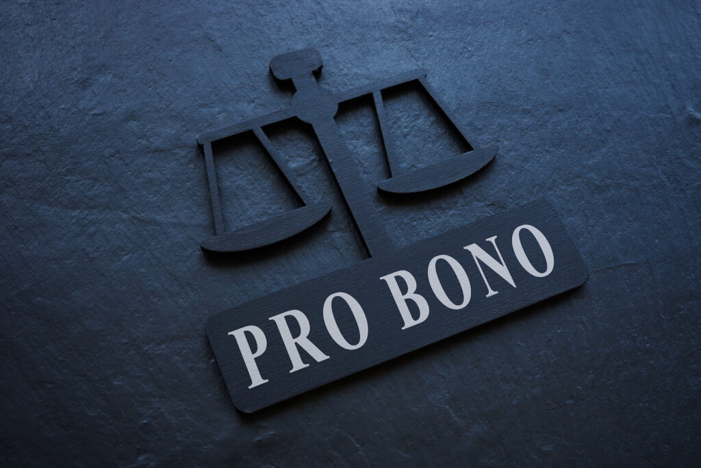 Graphic with blue background featuring justice scales and the words PRO BONO underneath
